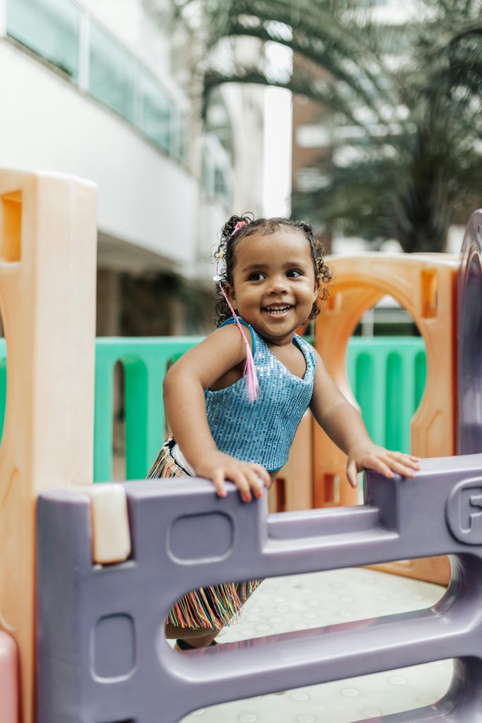 a little girl playing in the playground