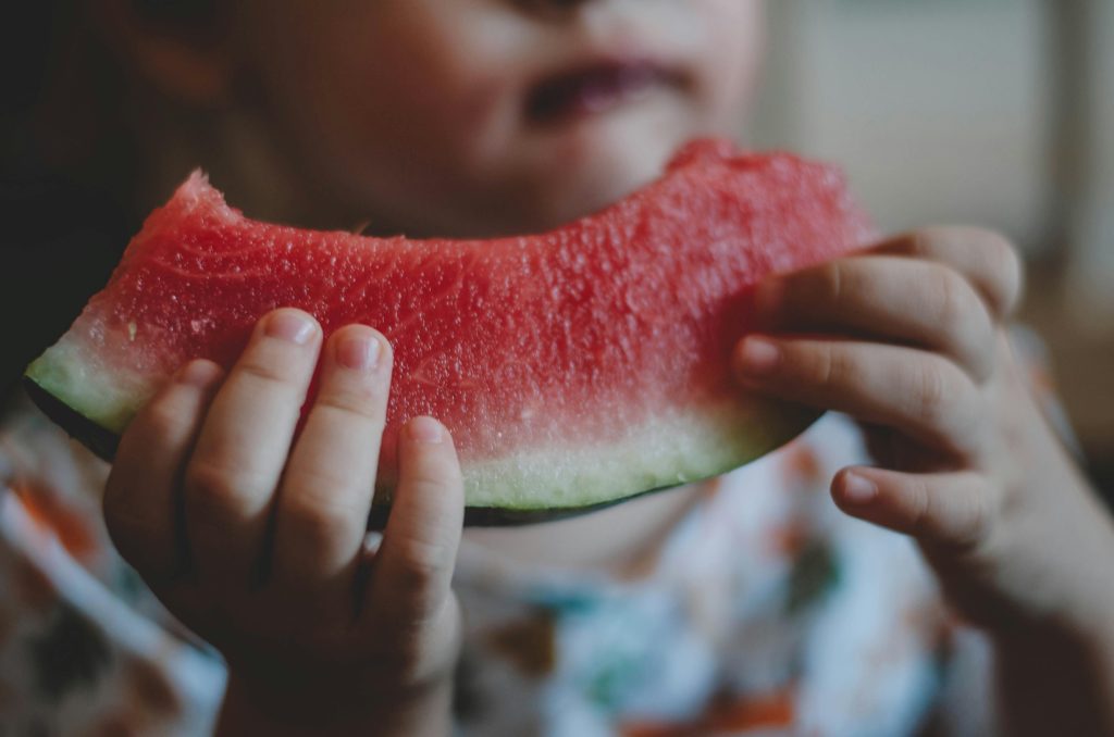 toddler eating water melon
